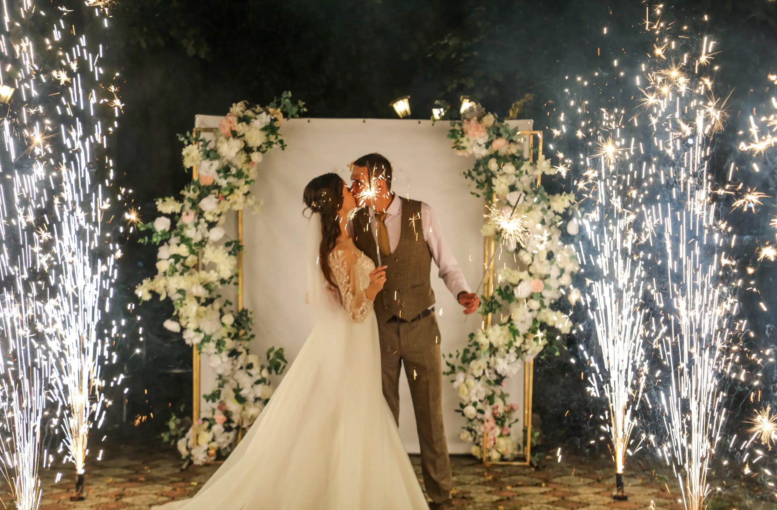 Bride and groom sharing their first dance surrounded by indoor cold spark effects during an Orlando wedding reception
