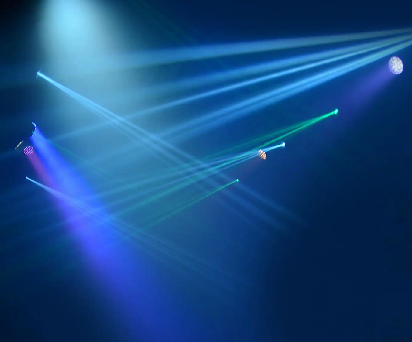 Atmospheric Halloween event lighting with colorful beams visible through haze