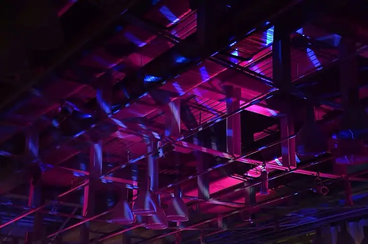 Halloween GOBO patterns projected across a venue ceiling with purple and blue lighting