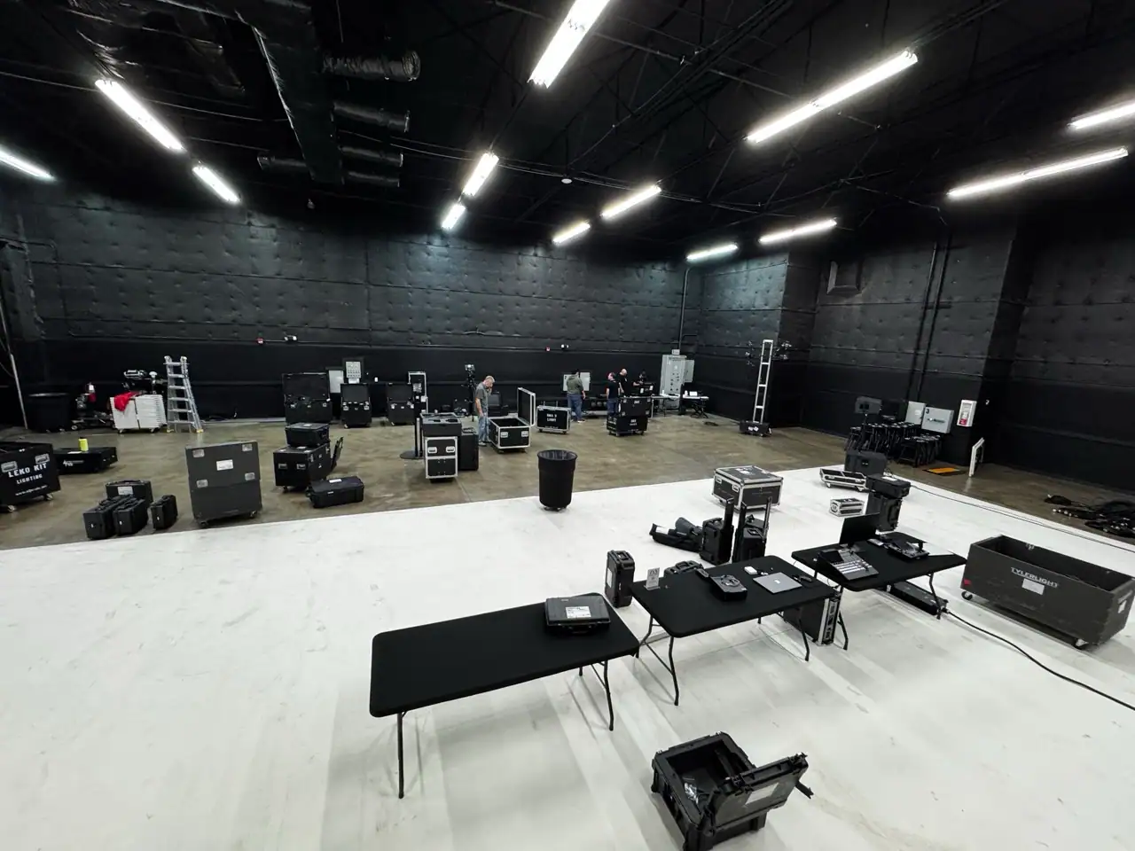 Behind-the-scenes setup of professional event lighting and AV equipment in an Orlando studio