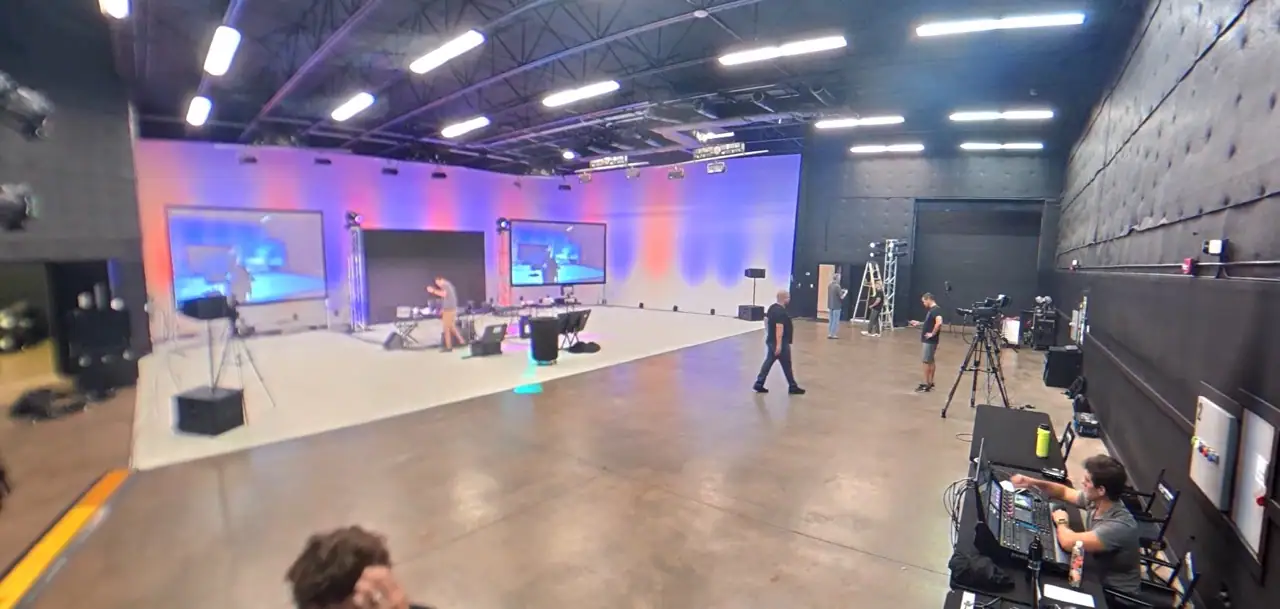 Orlando event production setup with LED uplighting projection screens truss and lighting equipment