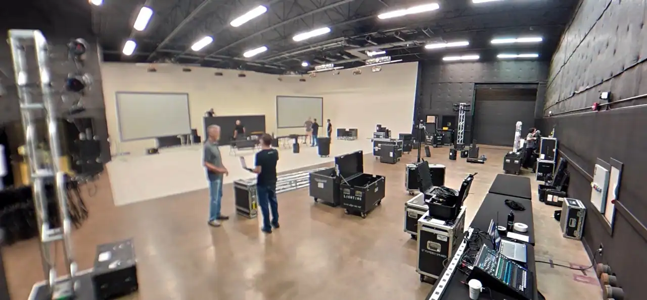Professional live event lighting and AV equipment being set up inside an Orlando production studio