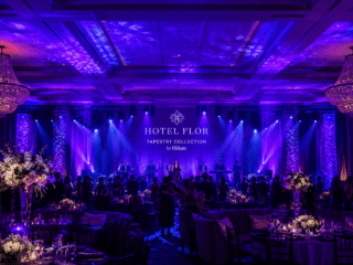 Purple uplighting and architectural lighting throughout an Orlando ballroom event