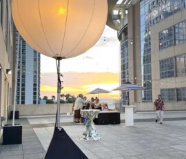 Large illuminated air-filled sphere installed at an outdoor Orlando event