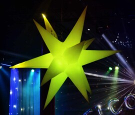 Green illuminated air-filled star used as decorative event lighting in Orlando