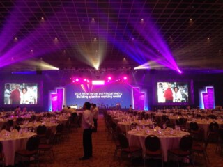 Purple stage and production lighting for a large corporate conference in Orlando