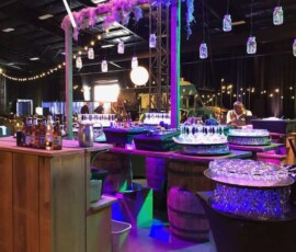 Colorful lighting illuminating a custom bar area at a corporate event in Orlando