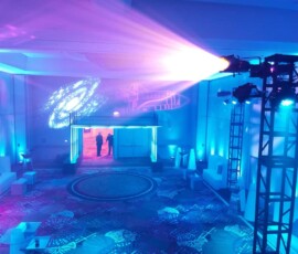 Blue uplighting and projected GOBO lighting inside a corporate event venue in Orlando
