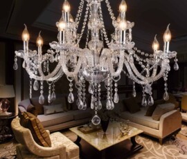 Elegant crystal chandelier with illuminated candle-style lights for an Orlando event setting