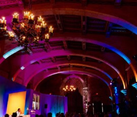 Premium event uplighting illuminating a ballroom for a corporate event in Orlando