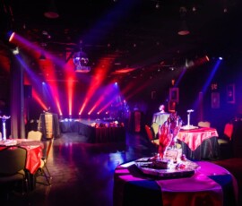 Dramatic red and purple event lighting for a themed Orlando production