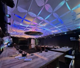 Permanent architectural lighting illuminating the ceiling and interior of an Orlando event venue