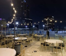 Bistro string lights illuminating an outdoor rooftop event space in Orlando
