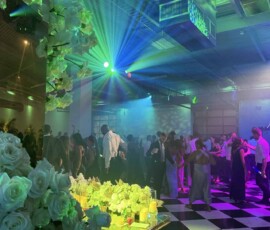 Orlando wedding reception dance floor with colorful green blue and purple event lighting
